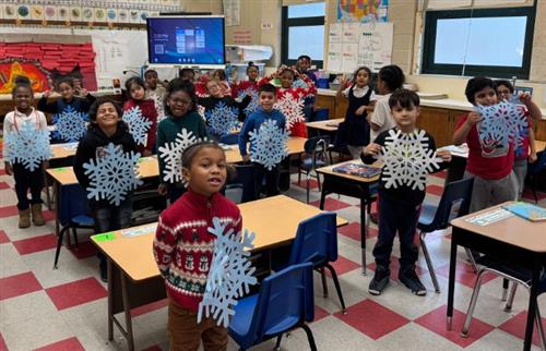 students posing with snow flakes